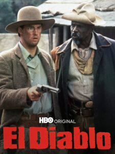 The poster for El Diablo, a schoolteacher holds a gun while a mercenary watches on helpfully